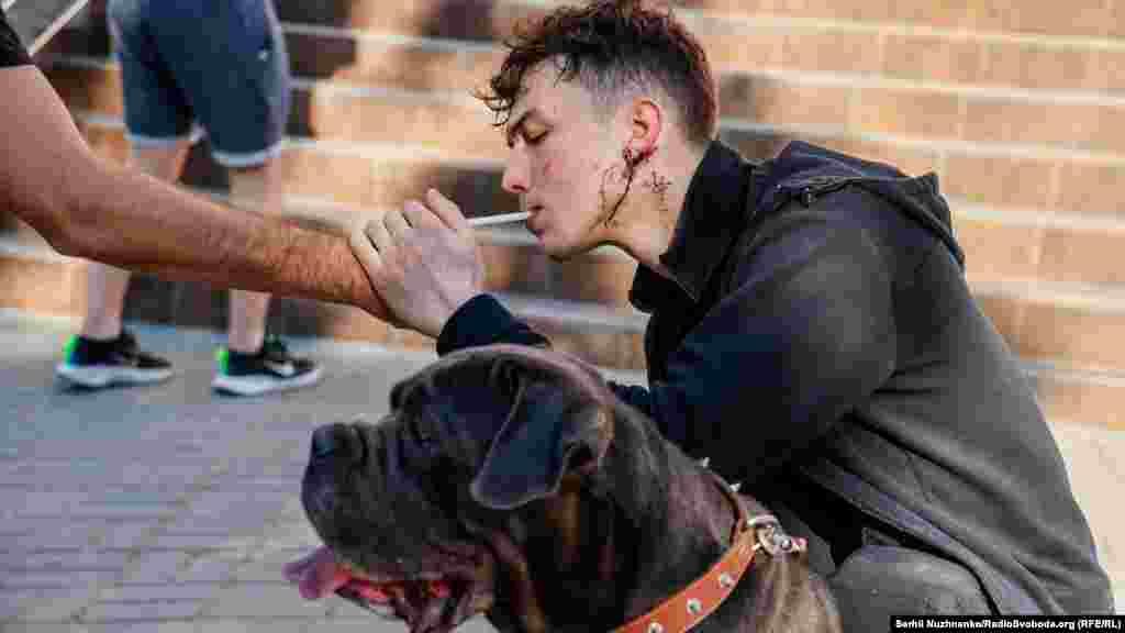 Bogdan, who was injured in the missile strike, and his dog Mira.