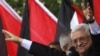 Palestine -- President Mahmud Abbas waves to the crowd during a celebration in the West Bank city of Ramallah, 25Sep2011
