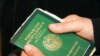 Жена одного из узбекских беженцев-мусульман держит в руках свой паспорт. Алматы, 13 декабря 2010 года.