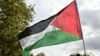 A protester waves a Palestinian flag during a march asking for the "recognition of the State of Palestine and the end of the genocide", in Paris on September 21, 2025.