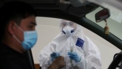 В мобильном пункте сдачи анализов на коронавирус. Алматы, 17 мая 2020 года.