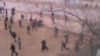 Скриншот с видео на сайте "Ютуб" о расстреле людей на площади в Жанаозене, 16 декабря 2011 года. 