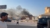 TOPSHOT - This frame grab taken from an AFPTV footage shows smoke billowing after explosions in Doha's capital Qatar on September 9, 2025.