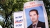Плакат-портрет Аршидина Исраила с протестом против его экстрадиции в Китай. Плакат принесли родственники Аршидина Исраила на митинг оппозиции. Алматы, 28 мая 2011 года. 