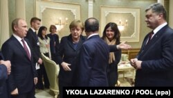 Сустрэча ў Менску лідэраў краін «нармандзкага фармату» (справа налева): прэзыдэнт Украіны Пятро Парашэнка, прэзыдэнт Францыі Франсуа Алянд, канцлер Нямеччыны Ангела Мэркель і прэзыдэнт Расеі Ўладзімір Пуцін, 11 лютага 2015