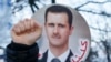 Сторонники сирийского президента Башара Асада митингуют во время переговоров по урегулированию конфликта