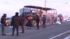 Полицейские у сгоревшего автобуса на трассе в Актюбинской области. 18 января 2018 года.