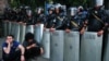 Митингующие на улице в Ереване перед линией ОМОНа во время акции протеста против повышения цен на электроэнергию, 24 июня 2015