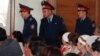 Полицейские в здании суда, где рассматривается дело о событиях в Шетпе. Актау, 17 апреля 2012 года.